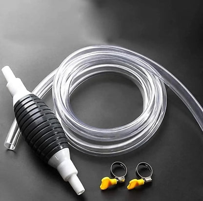 Clear hose with black and white pump and small clips on a dark background